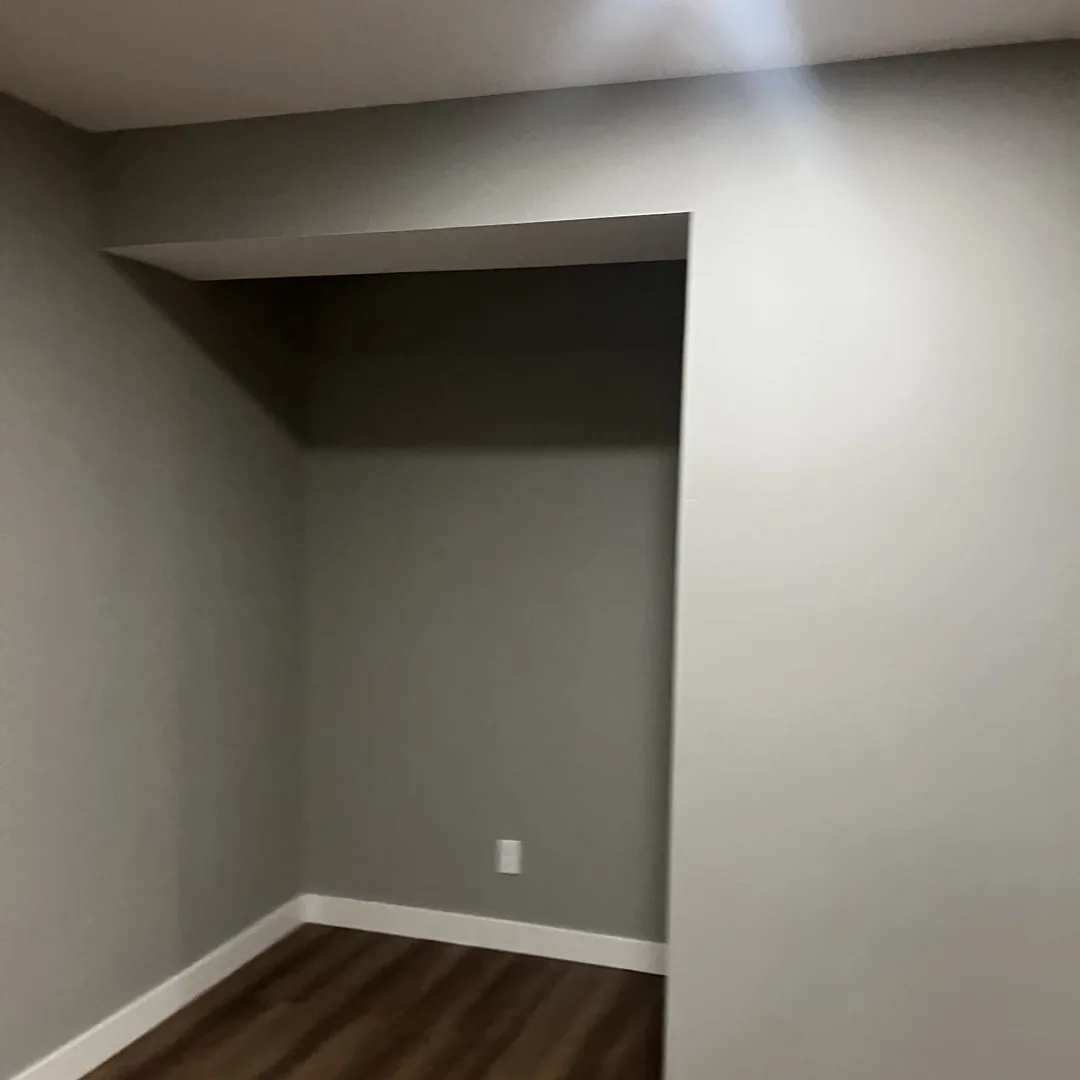 Finished basement living space with luxury vinyl plank flooring by MrImproveIt